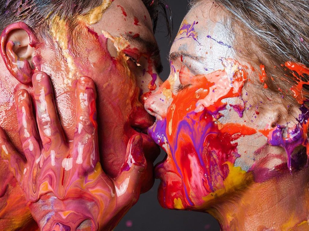 Photographer Tyler Shields Photograph of a couple kissing with paint dripping down their faces and hands