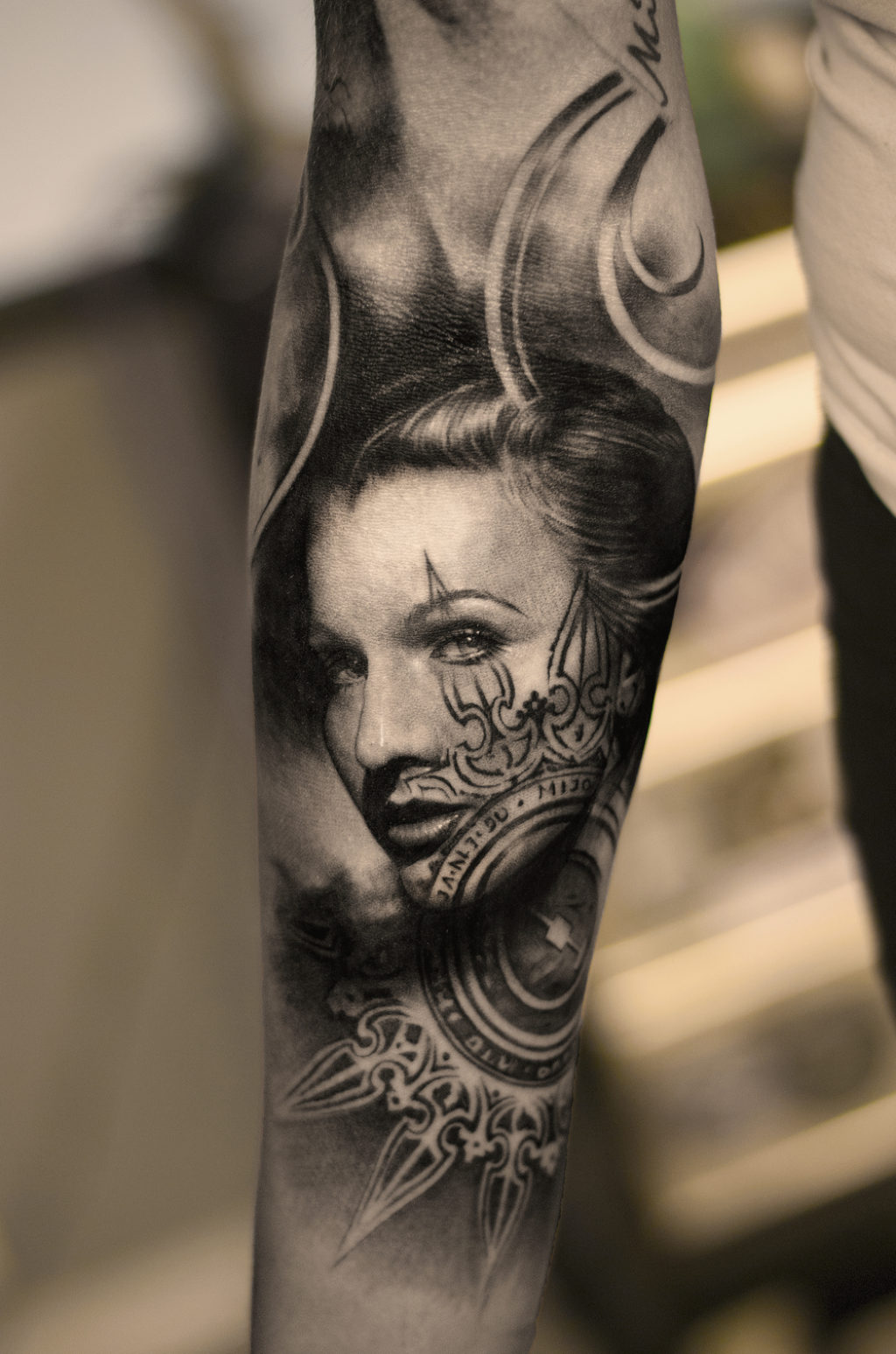 One of the most amazing Bang Bang Tattoos of a beautiful woman on a man's arm