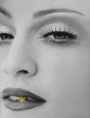 Black and White portrait of madonna with gold front tooth tooth