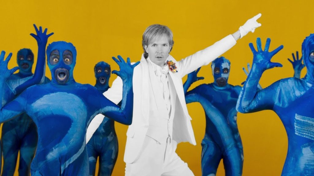 Musician Beck Wearing a White Tux in his music video, Colors, shot by Edgar White