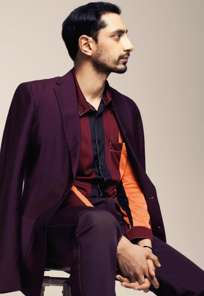 Profile of Actor Riz Ahmed Looking Fashion Forward in Maroon Suit