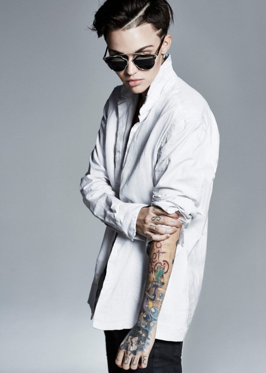 Ruby Rose white mens shirt tattoos sunglasses
