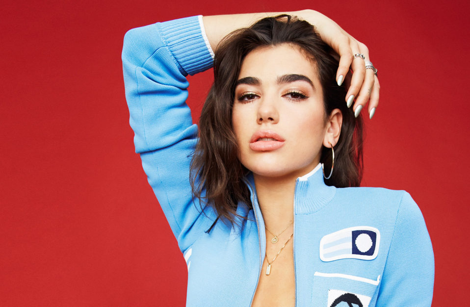 dua lipa blue open front sweater hand on head
