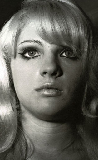photograph of a blonde woman taken by Diane Arbus