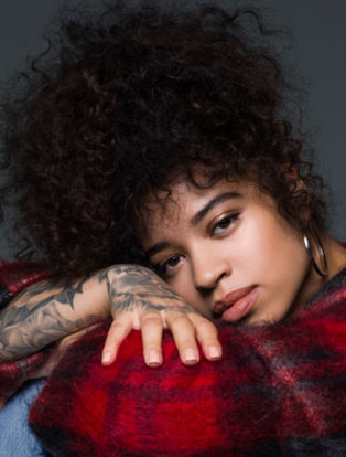 Ella Mai red plaid sitting