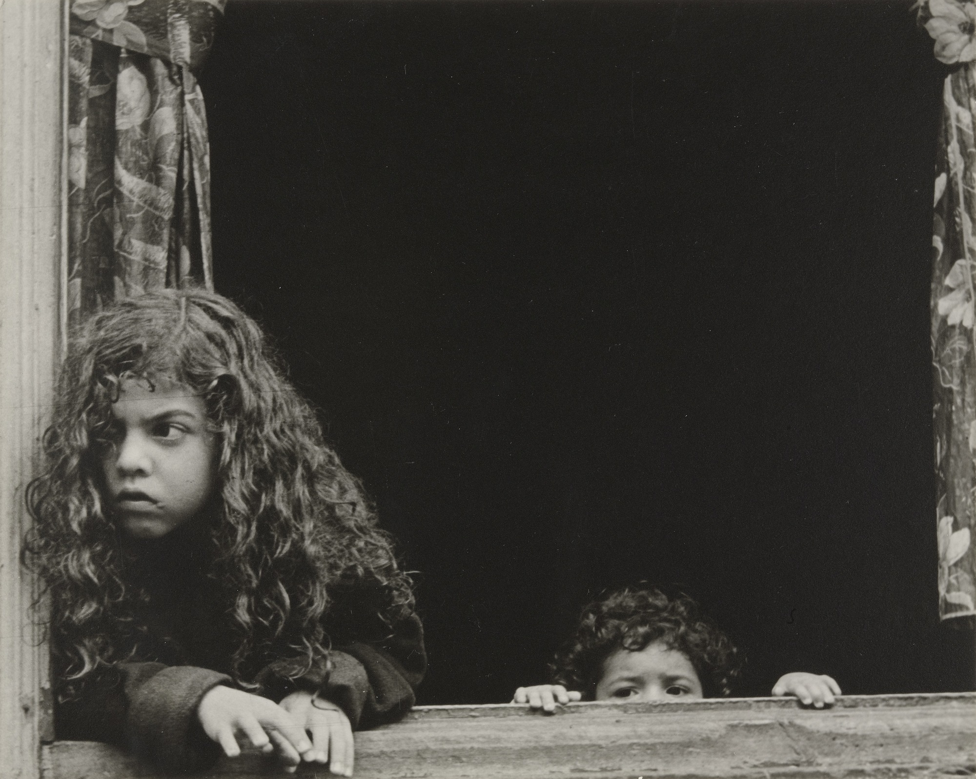 Two children in a window New York 1930s by Helen Levitt