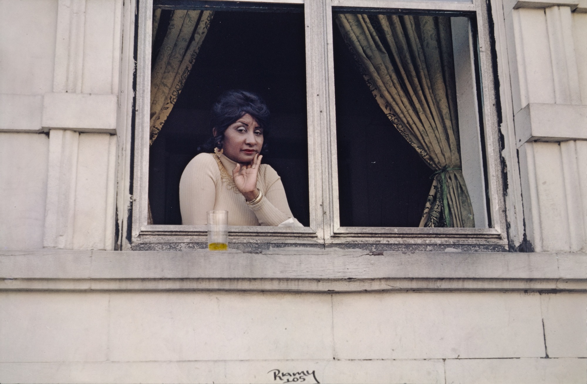 Woman in an apartment window, by Helen Levitt