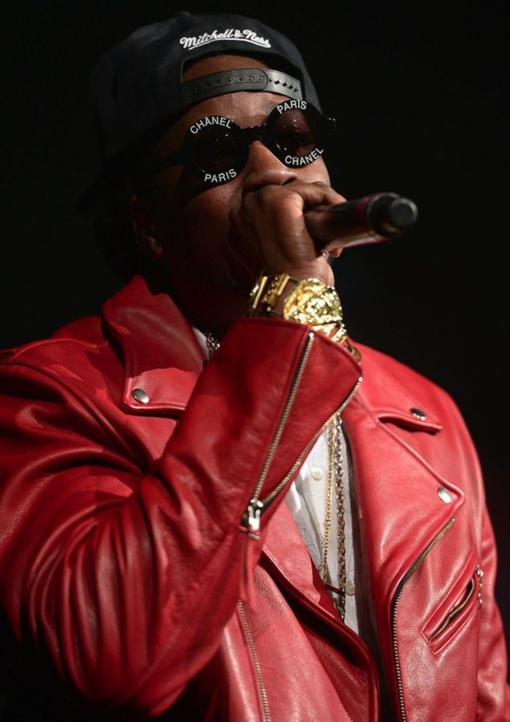 Kayne West Wearing A Red Leather Motorcycle Jacket and Chanel Sunglasses
