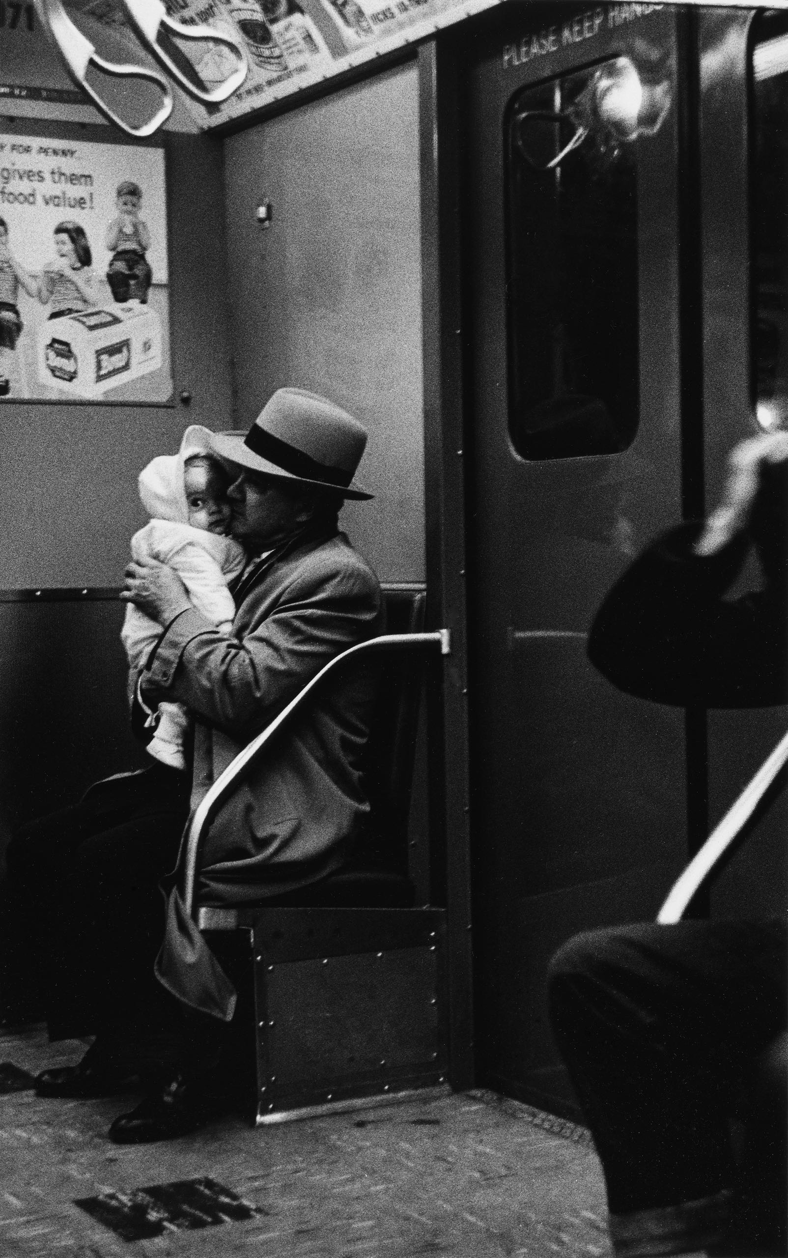 Diane Arbus photograph of a man and child in a subway car