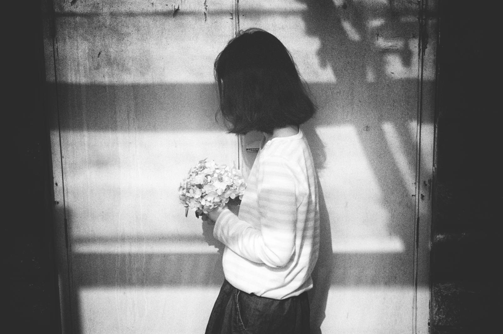 asian girl with a bouquet of flowers by Li Hui