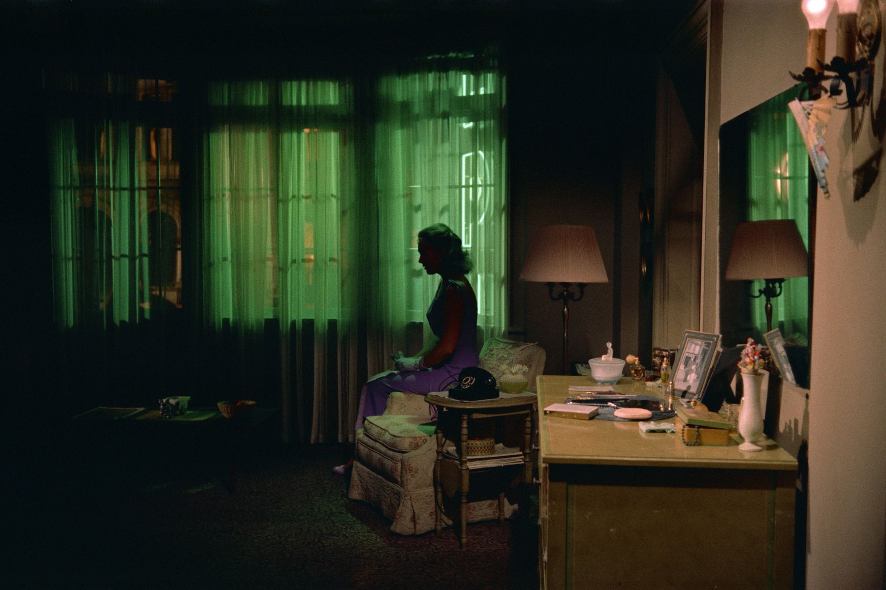 silhouette of a woman alone in an eerie room