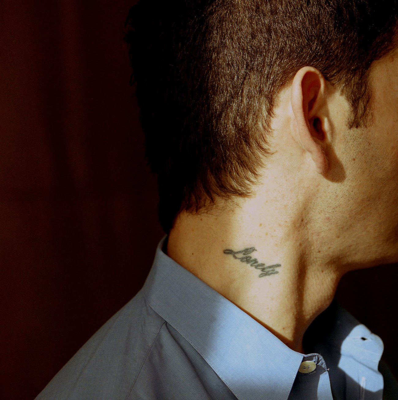 John Arsenault, "Lonely" man with a neck tattoo