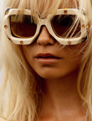 sexiest-fashion-photographers-inez and vinoodh-photo of a blonde model wearing white sunglasses adorned with topaz jewels
