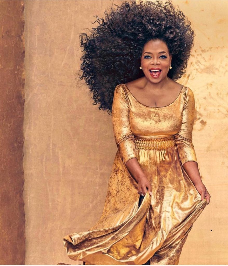 Oprah Winfrey Looking fabulous wearing a Gold Metallic Dress by Marc Bouwer
