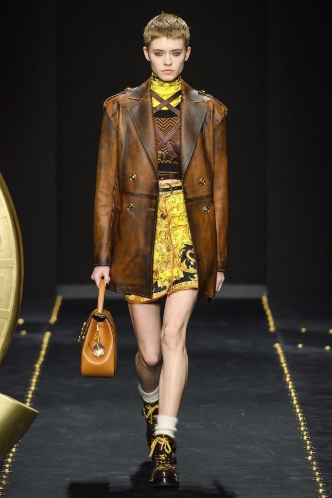Versace Fall 2019 Runway Show-Model with short bob wearing a leather coat jacket