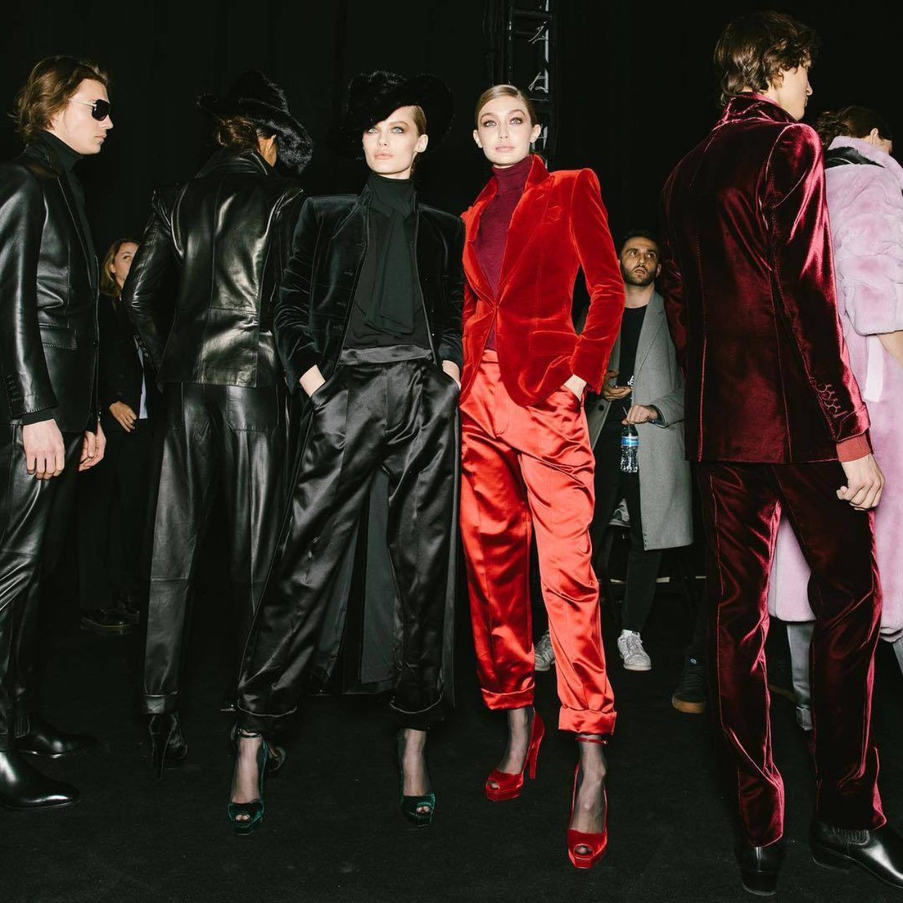 gigi hadid wearing red backstage at fashion week