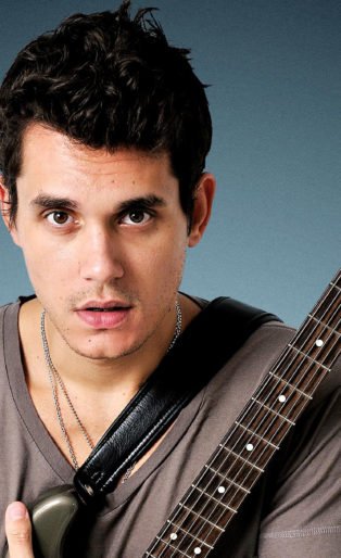 john mayer hugging guitar