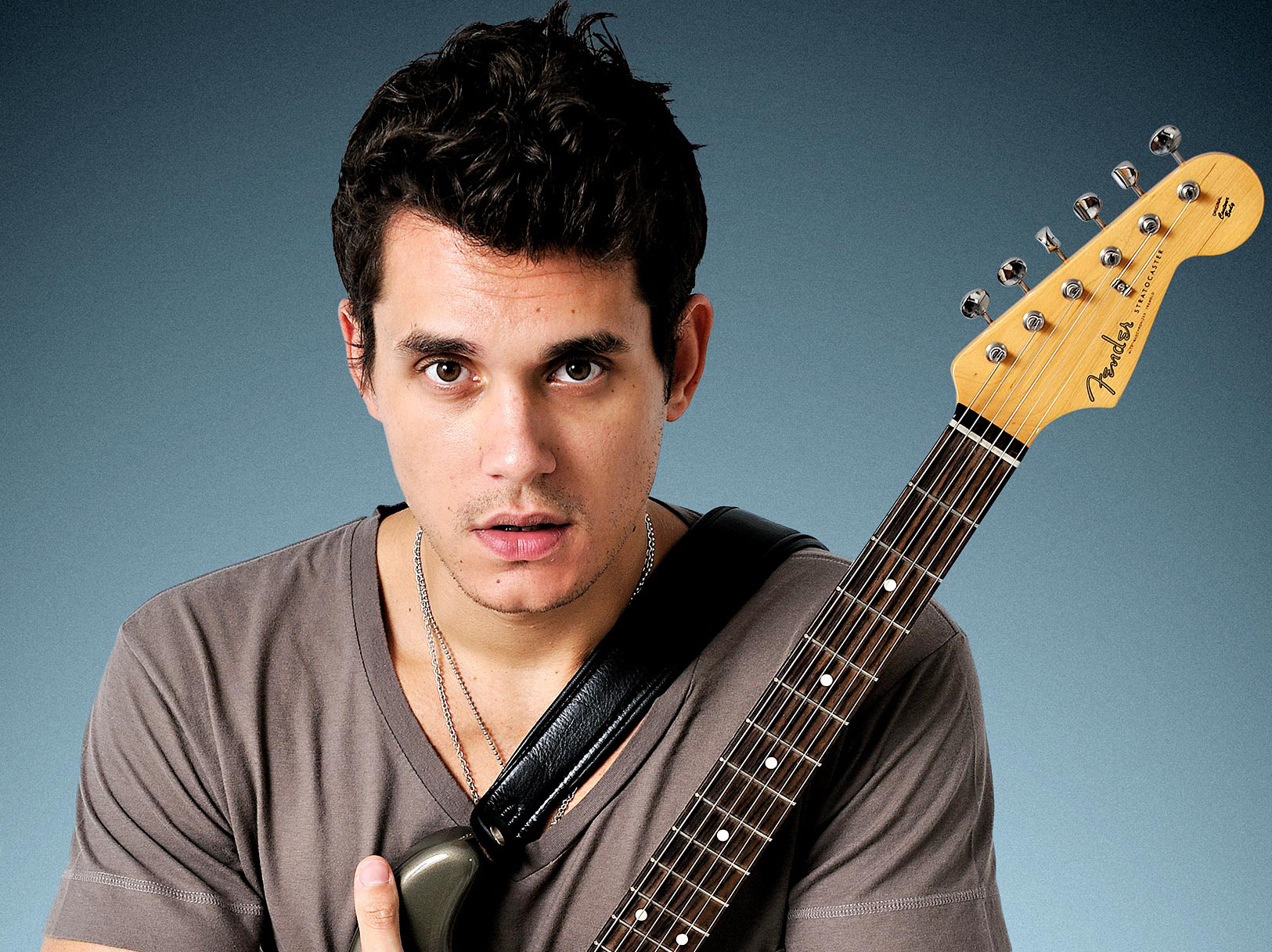 john mayer hugging guitar