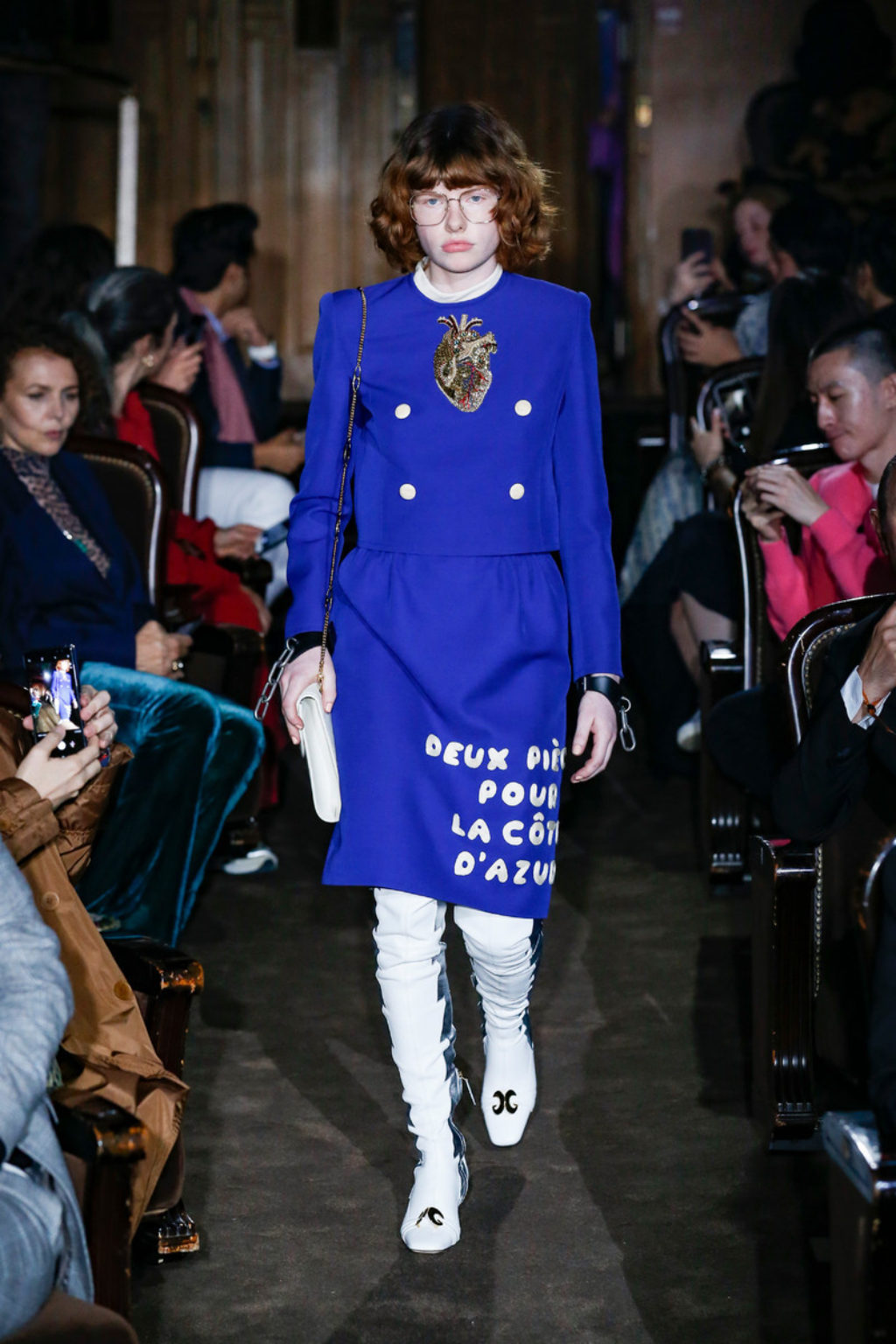 GUCCI_Womens Runway Model Wearing Royal Blue Top and Skirt with French Words Printed on the Skirt