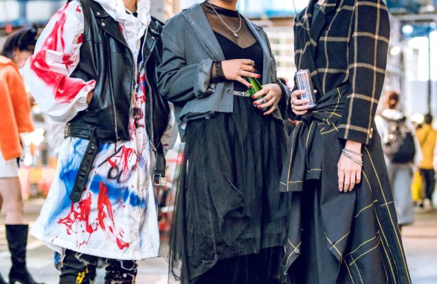 Tokyo fashion streetwear-Japanese youth in mixed patterns, styles and colors including one young man wearing a yellow New York shirt with number 23