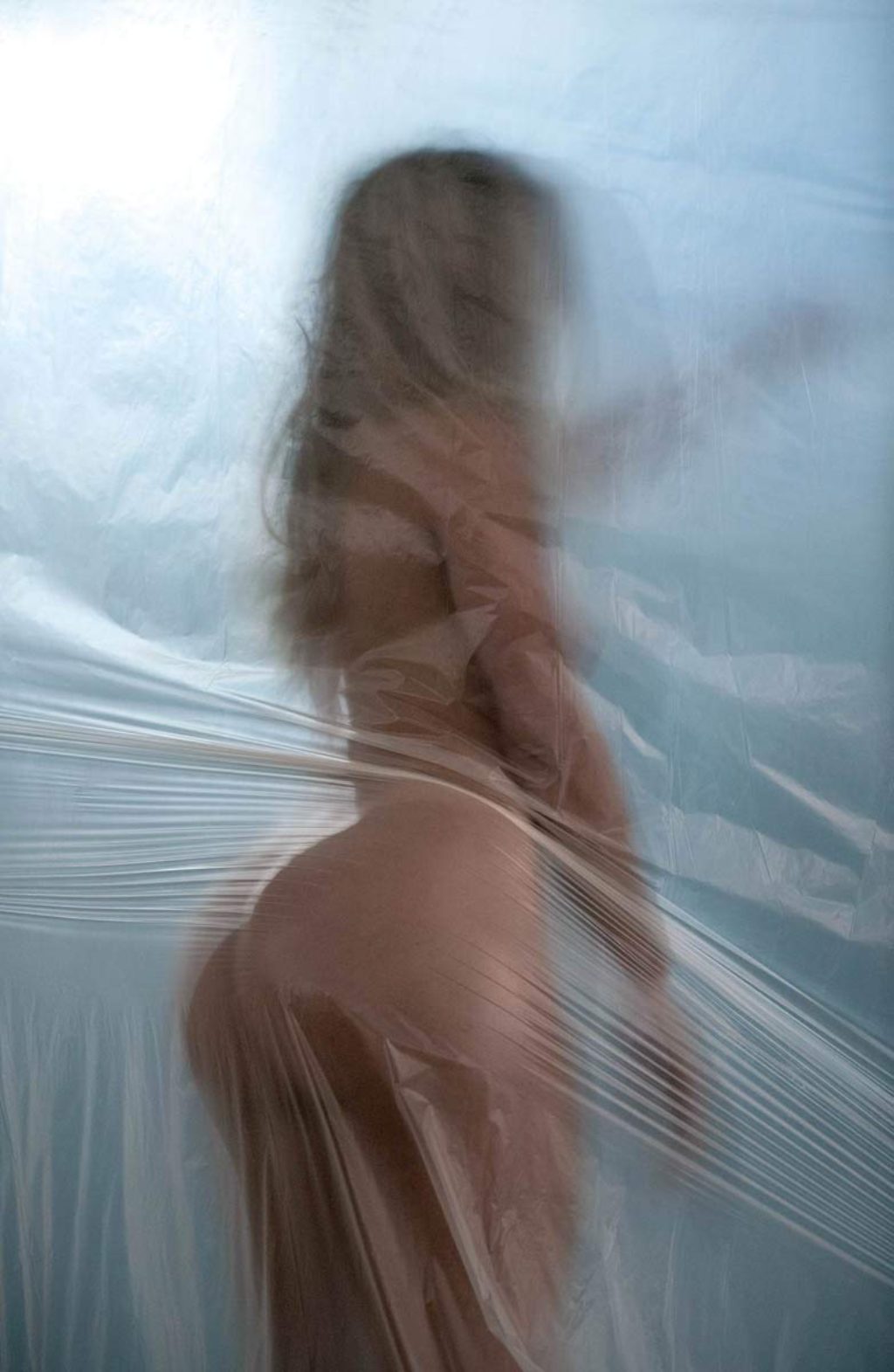 Kanye West Yeezy Zine Naked Model Leaning her big butt against a plastic covered wall