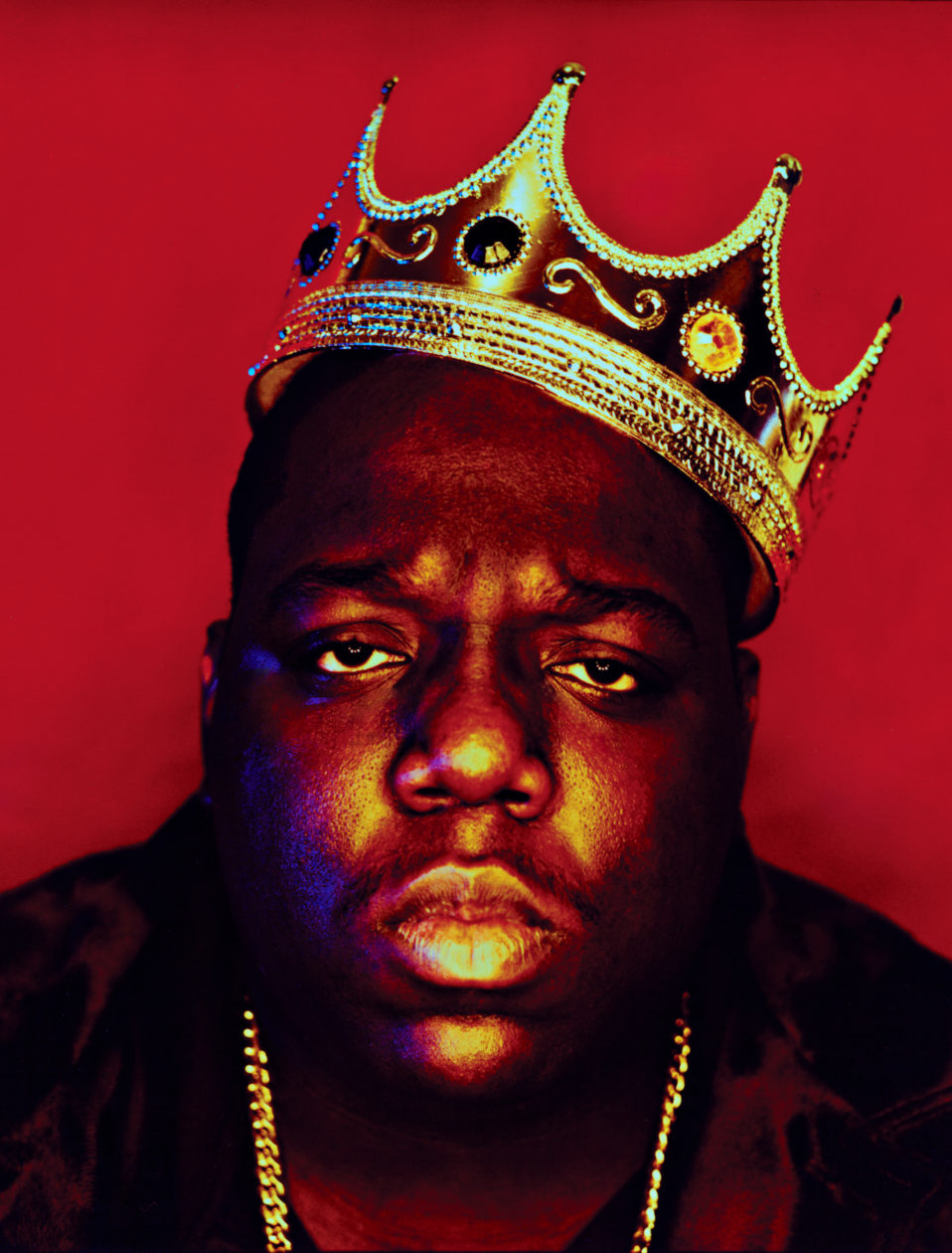 famous photograph of Biggie Smalls wearing a crown in front of a red background
