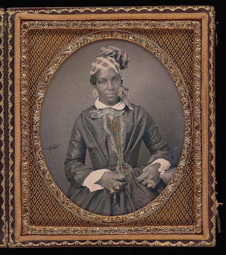 A formal portrait of a well-dressed woman of color taken circa 1850