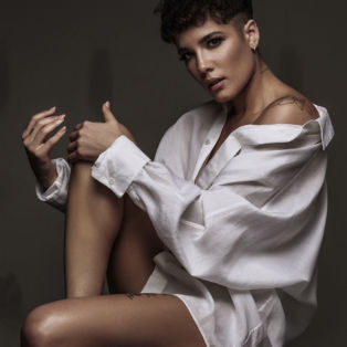 halsey-sitting-white-shirt-sexy-shoulder