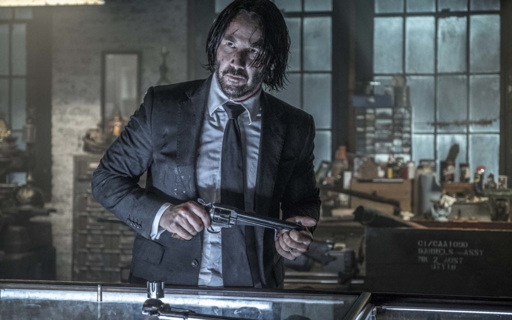 ohn-wick-3-Keanu Reeves holding a revolver