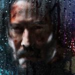 john-wick-3-keanu reeves behind a foggy window with water drips