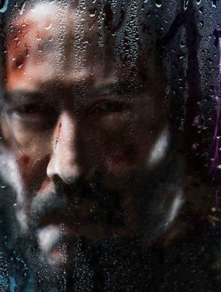 john-wick-3-keanu reeves behind a foggy window with water drips