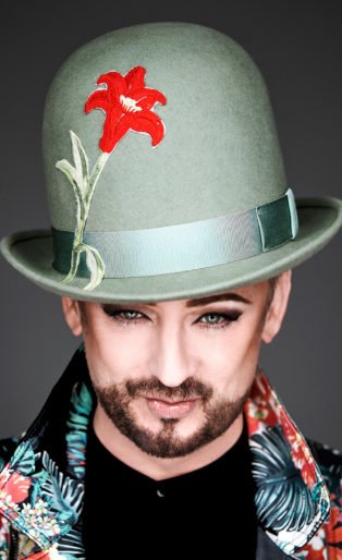 Boy George green hat red flower