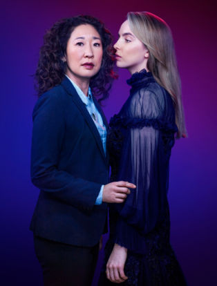 Killing Eve- Vilanelle wearing black sheer dress and Eve wearing navy suit