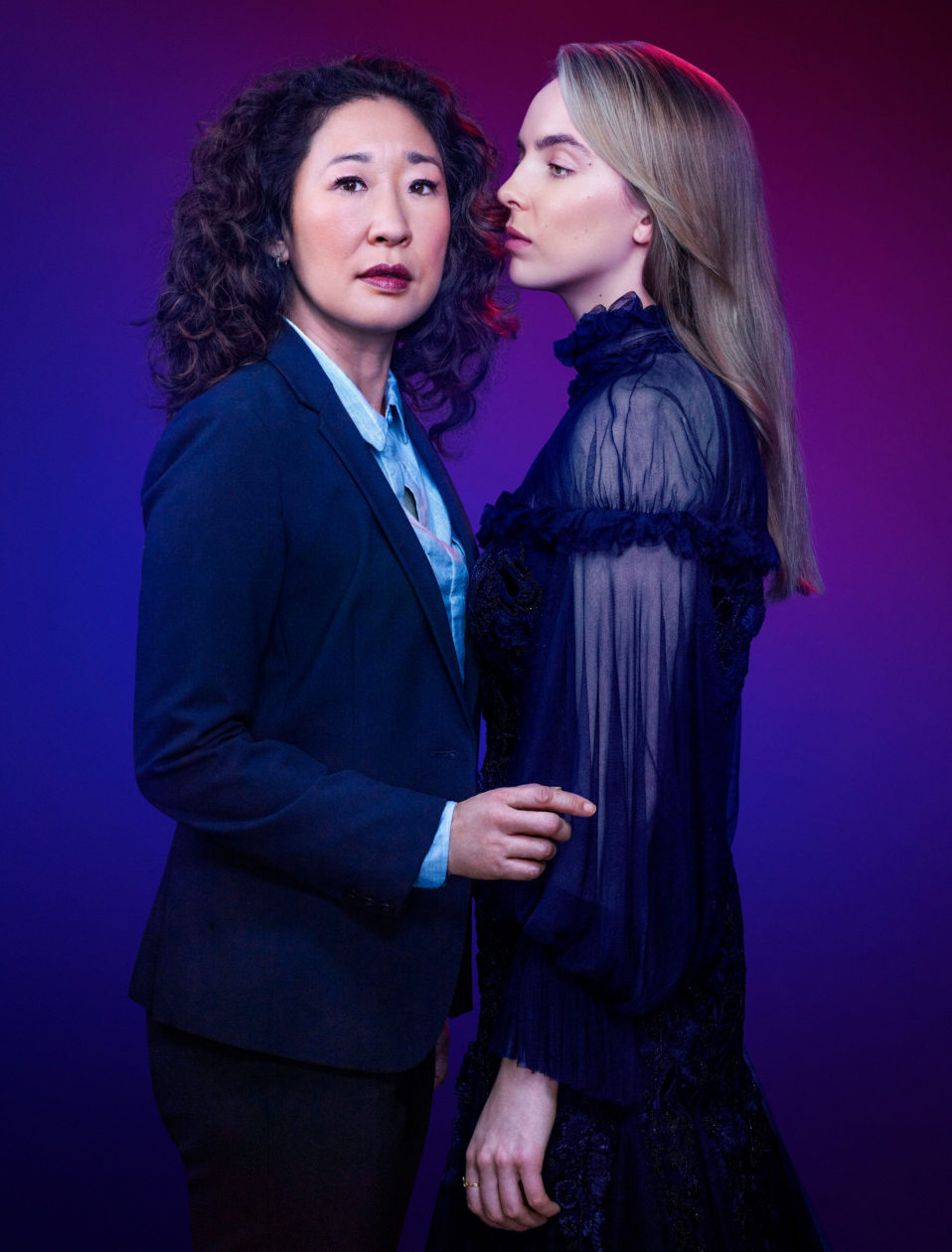 Killing Eve- Vilanelle wearing black sheer dress and Eve wearing navy suit