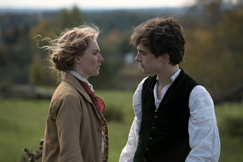 Saoirse Ronan as Jo Marsh and Timothee Chalamet as Laurie Laurie in Little Women