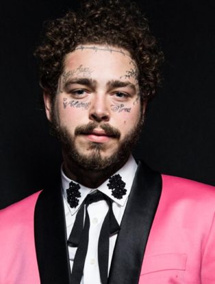 Post Malone in Pink Tuxedo with Black lapels-white shirt and skinny black cowboy tie