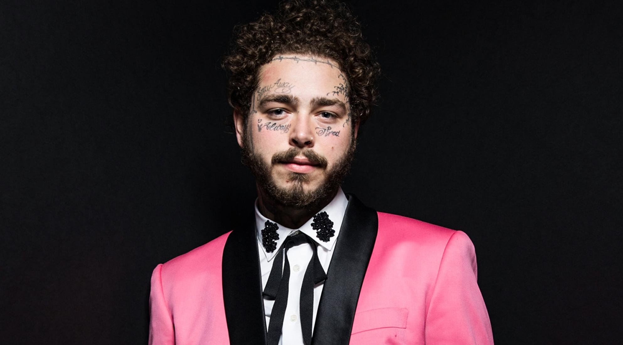 Post Malone in Pink Tuxedo with Black lapels-white shirt and skinny black cowboy tie