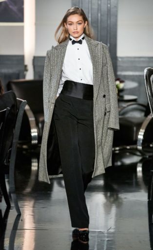 Model Gigi Hadid in Ralph Lauren Runway NY Fashion Week 2019 Wearing Sequined Tweed Black and White Coat-Tuxedo Shirt- Bow Tie-Cumberband and Black Pants