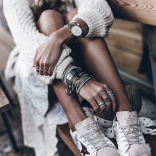 white canvas all star snearkers scuffed and worn in