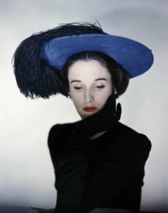 Miss Cushing Mortimer wearing a blue hat with plumes of feathers. (Photo by Erwin Blumenfeld/Condé Nast via Getty Images)