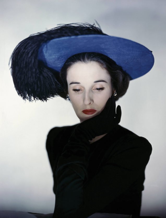 Miss Cushing Mortimer wearing a blue hat with plumes of feathers. (Photo by Erwin Blumenfeld/Condé Nast via Getty Images)