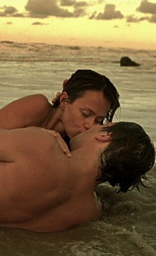 Couple kissing on the beach in the diving bell and the butterfly