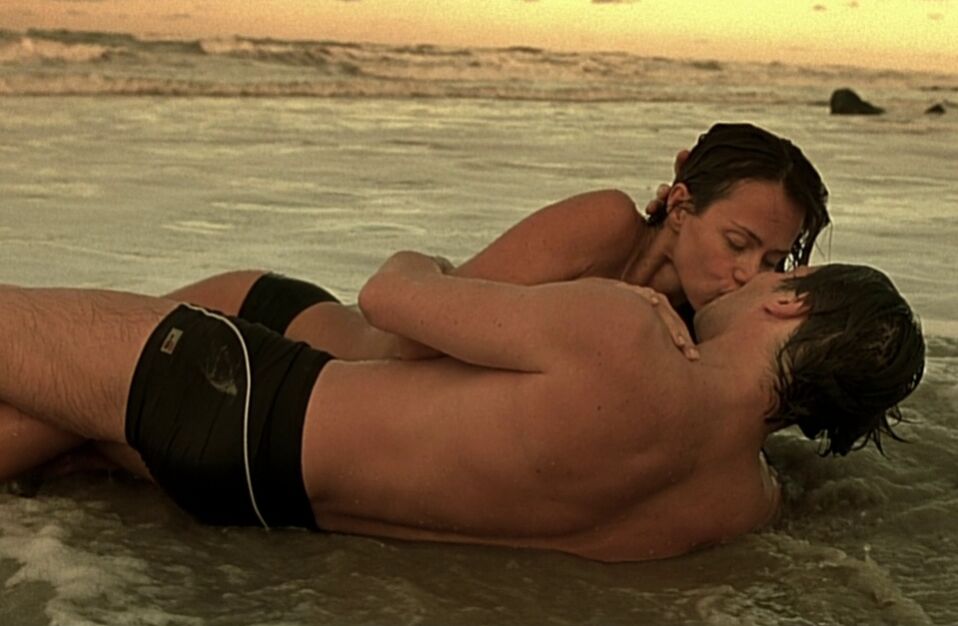 Couple kissing on the beach in the diving bell and the butterfly
