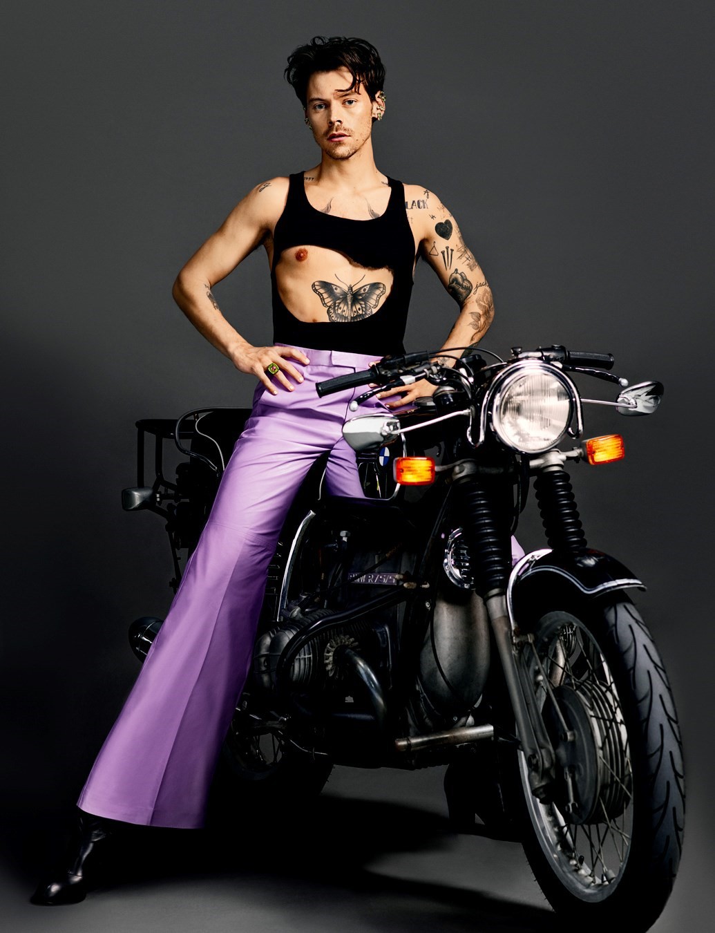 Harry Styles in Lavender Pants Sitting On A Motorcycle