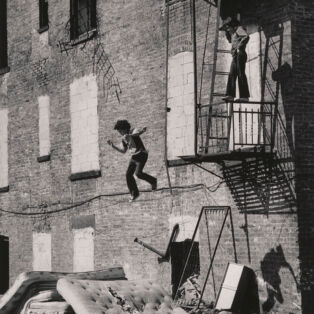 Martha Cooper Lower East Side [Boy Jumping from Fire Escape], 1978