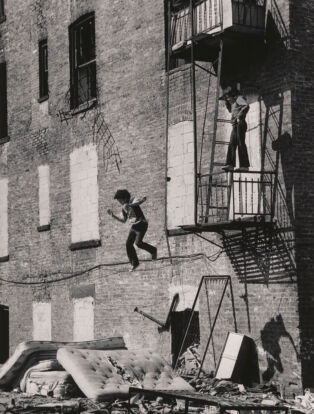 Martha Cooper Lower East Side [Boy Jumping from Fire Escape], 1978
