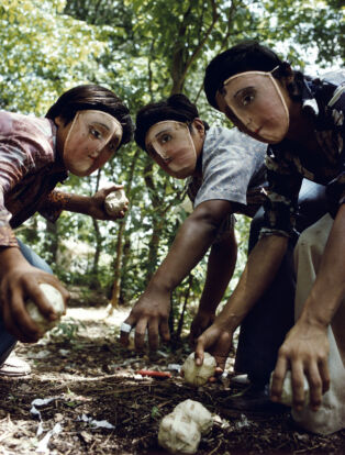 Susan Meiselas, Youths practice throwing contact bombs in forest surrounding Monimbo, 1978; printed later. Inkjet print on mesh. 26 1⁄2 x 39 3⁄4 in. Courtesy the artist. © Susan Meiselas/Magnum Photos