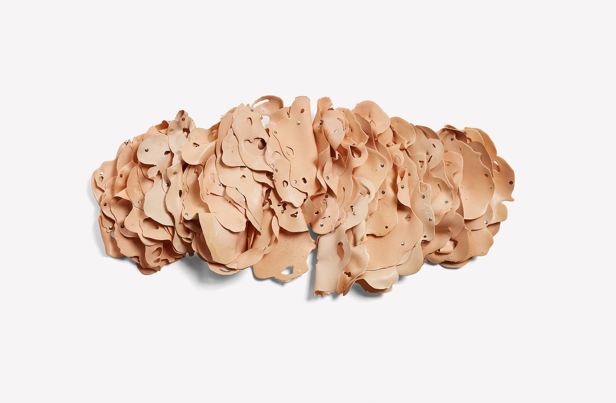 Hannah Wilke, The Orange One, 1975. Latex, acrylic paint, and metal snaps 18 x 38 x 3 inches (45.7 x 96.5 cm) Private Collection