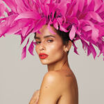 zoe kravitz portrait with pink feathers in her hair