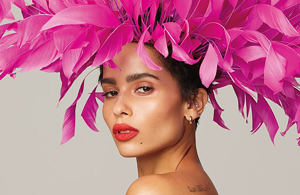zoe kravitz portrait with pink feathers in her hair